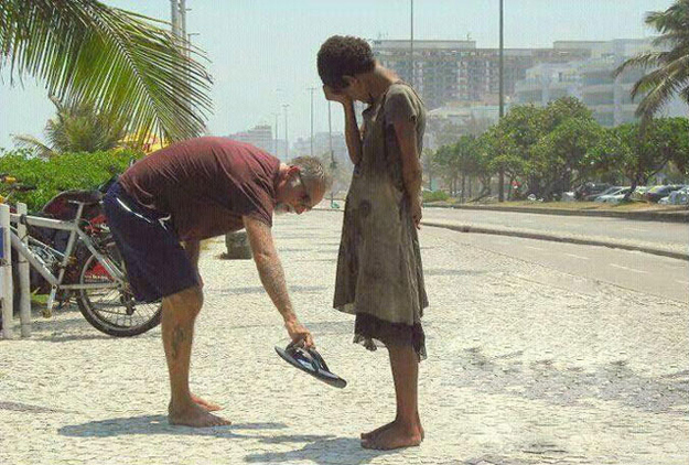 This photograph of a man giving his shoes to a homeless girl in Rio de Janeiro.