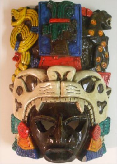 My souvenir from this trip. This is a Jaguar Mask that shows the jaguar at the bottom of the mask, a second jaguar at the top right hand side , the serpent at the top left and the last Mayan King, Pacal, in the top center of the mask.