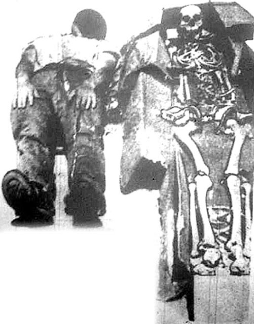 Figure 9: Les Eaton on the floor next to the 8-foot skeleton.