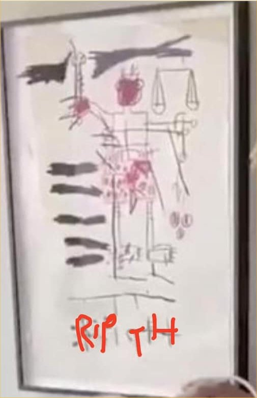 This was pointed out by one of our followers:  "On the board behind Ellen the writing says Rip TH! Do the scales in the drawing represent justice?"