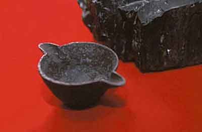 A cast iron pot found in a lump of coal.