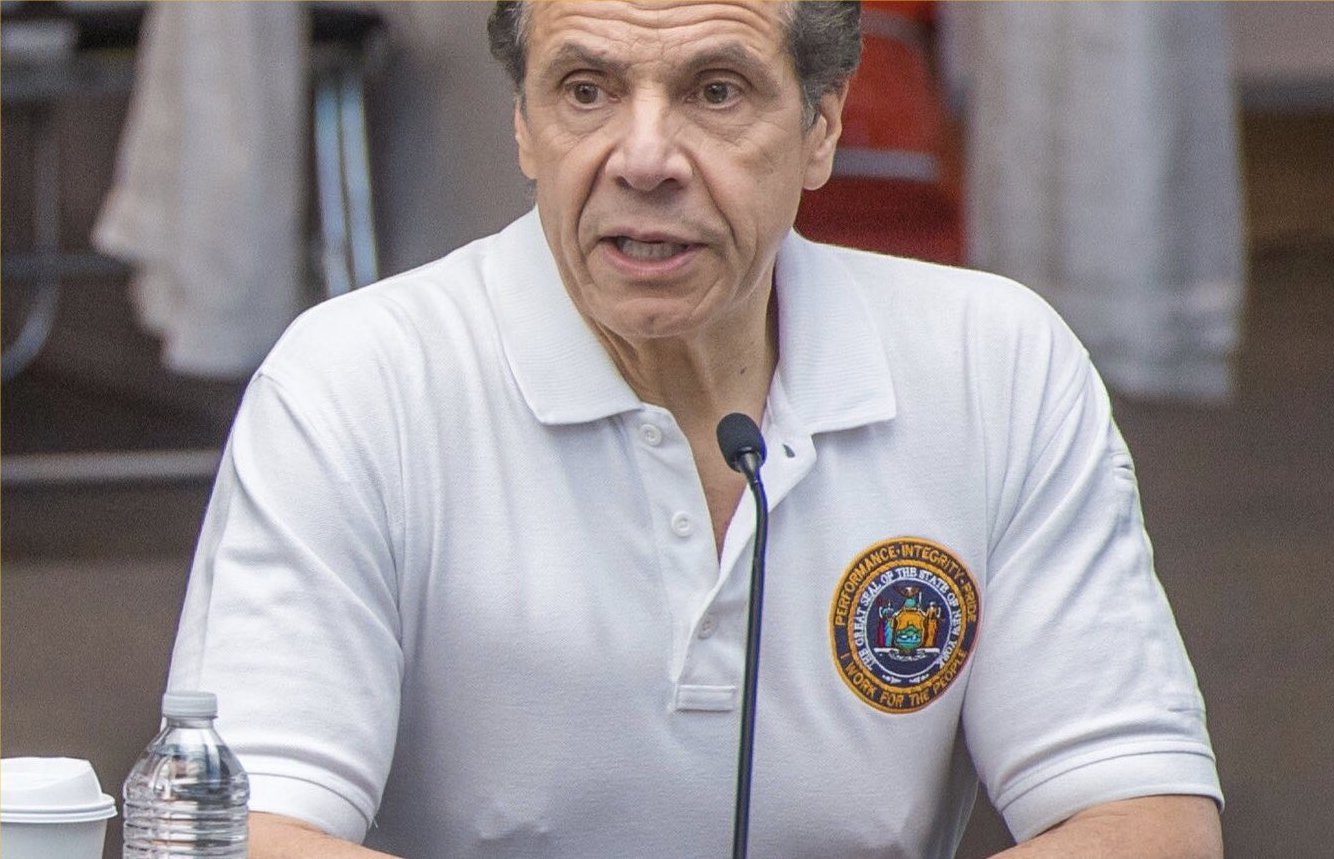 Andrew Cuomo wearing nipple rings during a press conference. According to Charley Freek, Trump made Cuomo wear these rings to show Cuomo’s criminal connections.